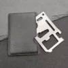 11-in-1 stainless steel pocket multi-tool card with multifunction tool openings